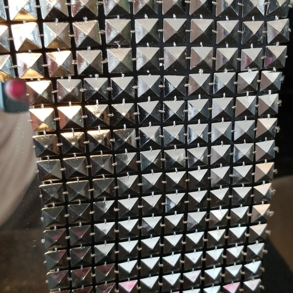 Modern studded wall mirror